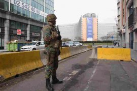 A Belgian soldier stands guard near the headquarters of the European Commission. There was an explosion at the nearby Maelbeek subway station during the morning rush hour on Tuesday.
