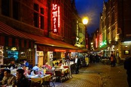 outdoof restaurants on an old city street in Belgium