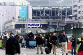 People are evacuated from the Zaventem international airport after a terrorist attack early Tuesday in Brussels.