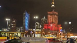 The Palace of Culture, right, the tallest building in the Polish capital, is lit in the colors of the Belgian flag in solidarity with the victims of the attacks in Brussels, in Warsaw, Poland, on Tuesday March 22, 2016.